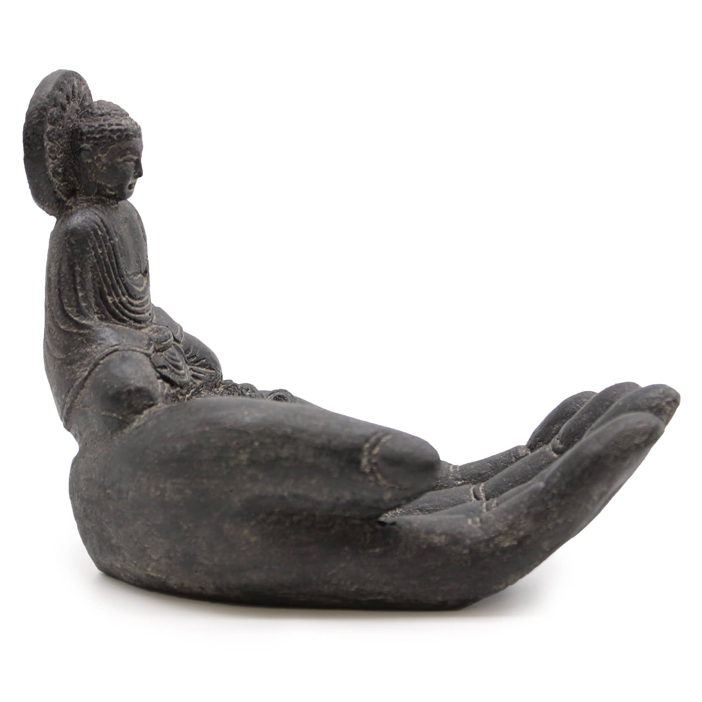 Vue de profil du porte-encens main de Bouddha en pierre noire, montrant la courbe naturelle de la main et les détails sculptés.
