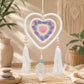 Attrape-rêve en double cœur macramé blanc avec mandala crocheté pastel violet jaune rose et deux pompons.