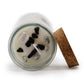 Bougie équilibre artisanale enrichie d’agate noire et jaspe blanc – parfum ylang-ylang.