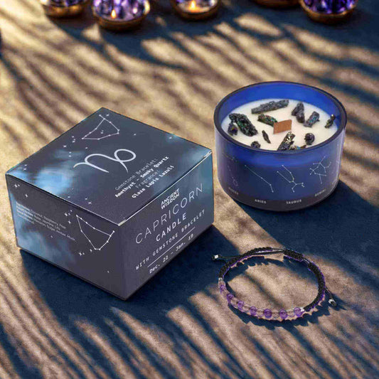 Bougie zodiaque Capricorne constellation avec bracelet pierres améthyste et quartz fumé dans coffret bleu.