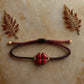bracelet porte bonheur trèfle 4 feuille en cinabre.