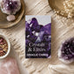 Boîte blanche du jeu d'oracle Crystals & Elixirs avec photo d'améthyste violette