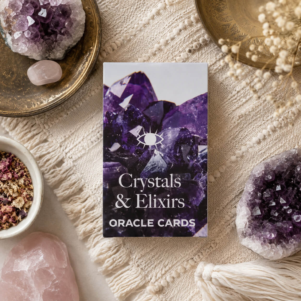 Boîte blanche du jeu d'oracle Crystals & Elixirs avec photo d'améthyste violette