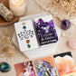 Dos de carte du jeu d'oracle avec logo fleur de lotus, entouré de pierres naturelles